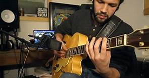 Guitarist Nathan Towne playing "Almost Like Being in Love" on an archtop guitar