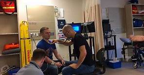 Paramedic demonstrating treatment of a heart attack (myocardial infarction)