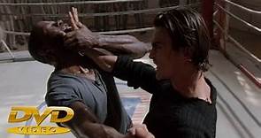 Daniel Bernhardt fights with a black fighter in the movie Bloodsport: The Dark Kumite (1999)