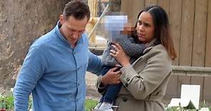 Tom Hiddleston and fiancée Zawe Ashton dote over their baby during Paris stroll