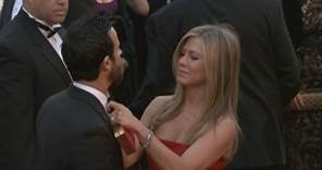 The Oscars 2013: Jennifer Aniston fixes Justin Theroux's bow tie on the Oscars red carpet