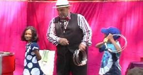 Joseph Fields performs a magic show for children