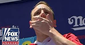 Joey Chestnut takes down protester