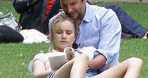 PDA of the Day: Bradley Cooper and Suki Waterhouse Cozy Up While Reading a Paperback in Paris - E! Online