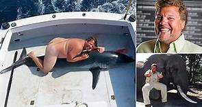 Hunt for mysterious nude man who was pictured straddling a dead shark - as Jimmy John's founder DENIES it is him
