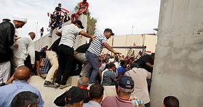 Baghdad is under a state of emergency after protesters stormed the parliament building in the heavily fortified Green Zone