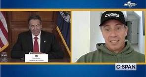 Governor Andrew Cuomo talks to his brother Chris Cuomo
