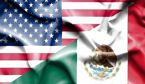 Banderas de México y Estados Unidos pintado en la pared agrietada