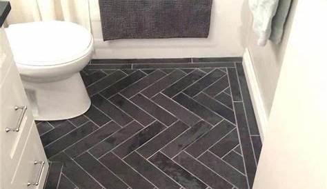 Bathroom flooring? Dapple grey wood look herringbone tile. Would need