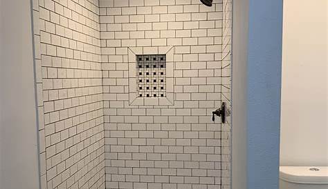 White subway tile with black grout. Hexagon Floor. White subway tile