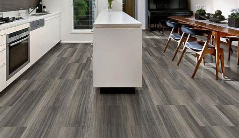 Vinyl flooring in shades of gray installed in a kitchen. Flooring