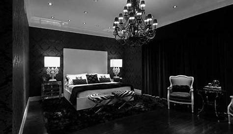 a bedroom with black walls and brown bedding