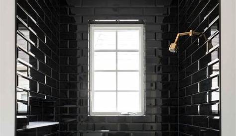 Love this statement-making, bold, black soaking tub! The classic tile