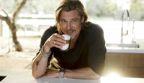 Brad Pitt drinking a cup of coffee on the set of Angelina Jolie's