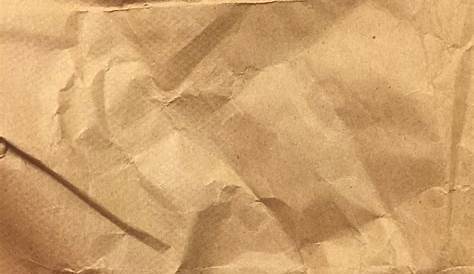 Crumpled Brown Paper Bag Close Up Texture Background. Stock Photo