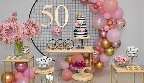 a 50th birthday party with balloons and flowers