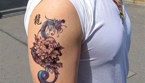 Dragon with flowers tattoo on wrist | Dragon tattoo for women, Dragon