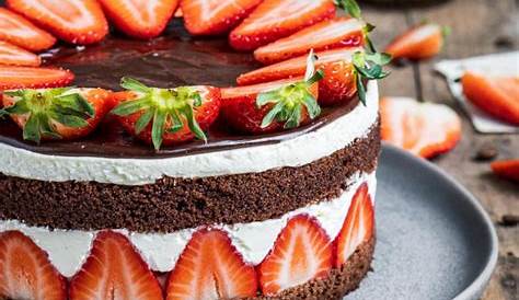 there is a large cake with strawberries on it