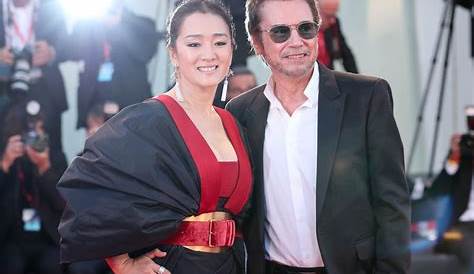 Chinese actress Gong Li, right, and her husband Jean Michel Jarre pose