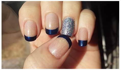 Graceful Glamour: Sapphire Blue Attire With Bronze Nails For A Dazzling Effect