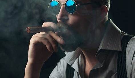 Man Smoking a Cigarette and Holding Handgun Stock Image - Image of