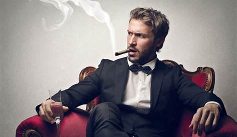 Senior Man Sitting On Sofa Smoking Cigar And Holding Glass Portrait