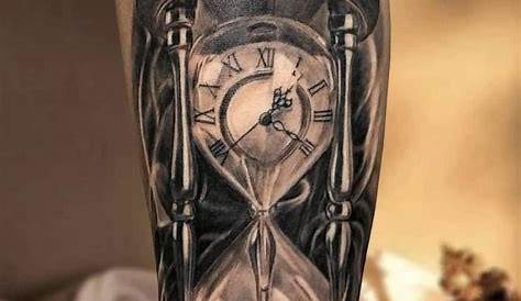 a man with a clock and hour on his arm, holding an hourglass tattoo