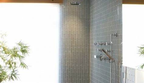 minimalist Japanese bathroom with black tiles and light woods