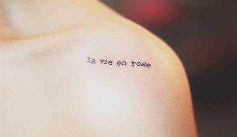 'La vie en rose' tattoo on the left inner forearm.