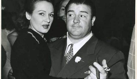 Lou Costello showing off his first grandchild on the set of "Abbott