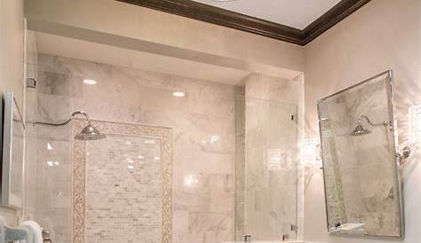 Large square marble wall tiles in a transitional shower delivers a