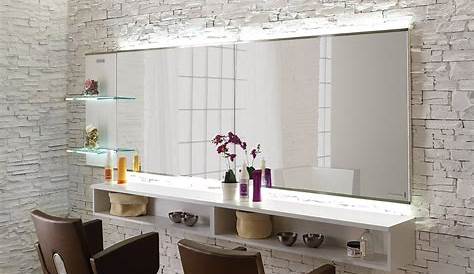 a bathroom mirror and shelf with two mirrors on the same wall, one has