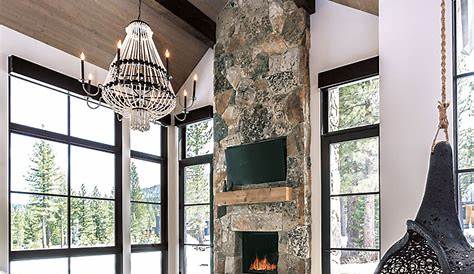 Rustic modern mountain bedroom with large, natural wood bed and white