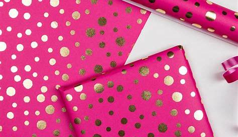 a pink and gold foiled wrapping paper with metallic stripes on the