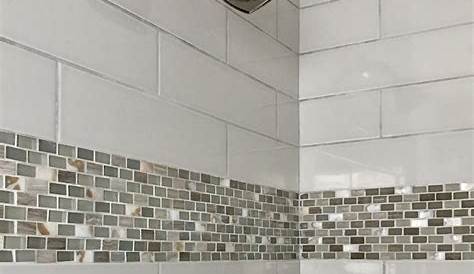 white porcelain tile shower with tile bench and angled curb and half