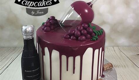 Red wine bottle birthday cake with customized label and grapes on top