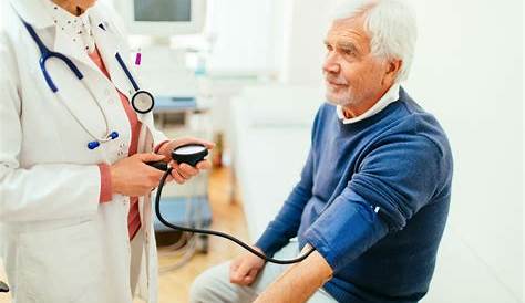 Young Doctor Examining Schoolboy for Regular Check-up Stock Photo