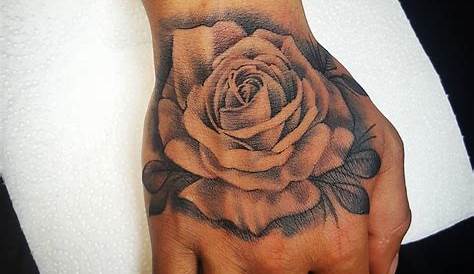Classically placed rose hand tattoo by Lachie Grenfell | Rose hand