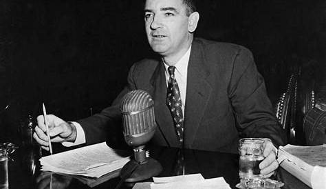 Senator Joseph R. McCarthy waves a document while delivering a... News