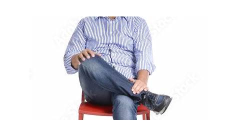 Premium Photo | Handsome man sitting on a chair and showing ok sign