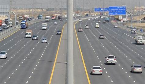 Road signs and traffic on Sheikh Zayed Road, Dubai, United Arab