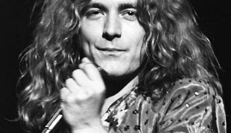 Lead singer of group Led Zeppelin Robert Plant with an Ivor Novello
