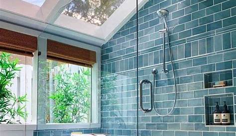 Tile shower with bench seat in Cambria quartz, Tiled wall niche, Moen