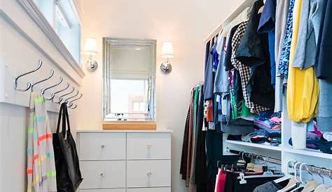 Lots of shelves and hanging in a small corner closet. #closetdesign