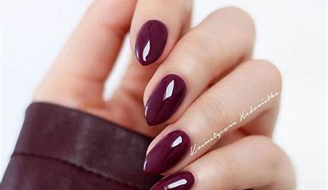 Subtle Allure: Wine Red Clothing With Peach Nails For A Gentle Presence