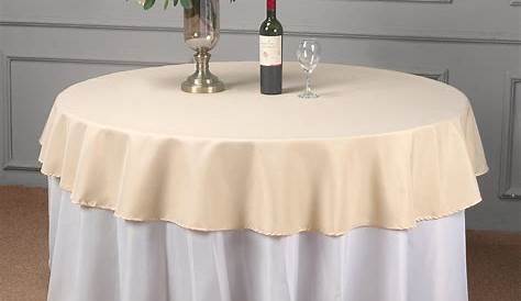 Fitted tablecloth in gray and white fretwork print. Tailored round