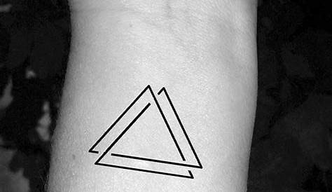 Two triangles by tattooist Nemo inked on the left wrist