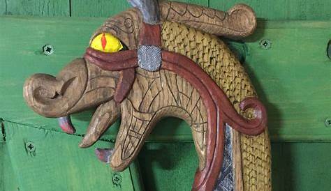 Carved wooden dragon figurehead on the prow of a replica Viking