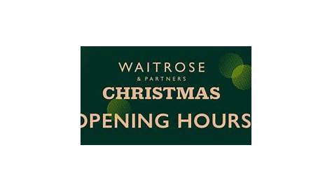 Waitrose opening hours sign Stock Photo - Alamy