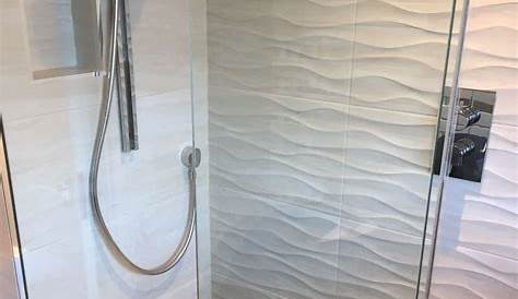 Our modern bathroom rebuild. White Herringbone feature tile All white